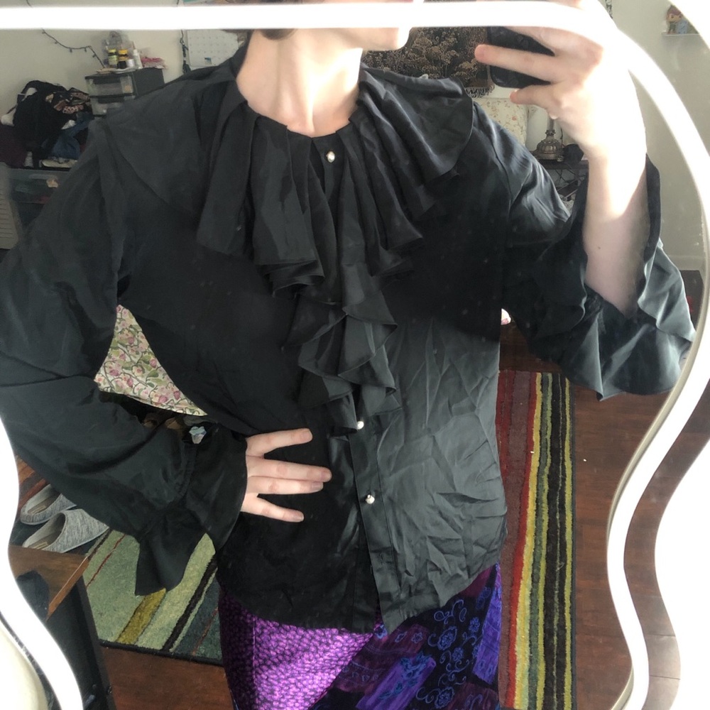PRICE FIRM Black ruffle neckline and cuff blouse with pearl buttons